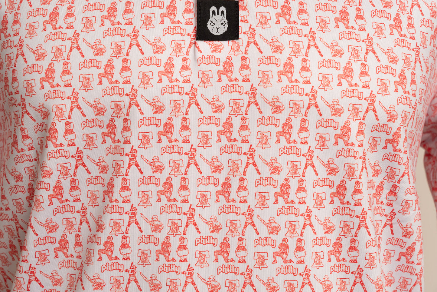 Close-up of The South Philly Sandlot Philly baseball golf polo by Foresome Golf Co. showing texture and logo.