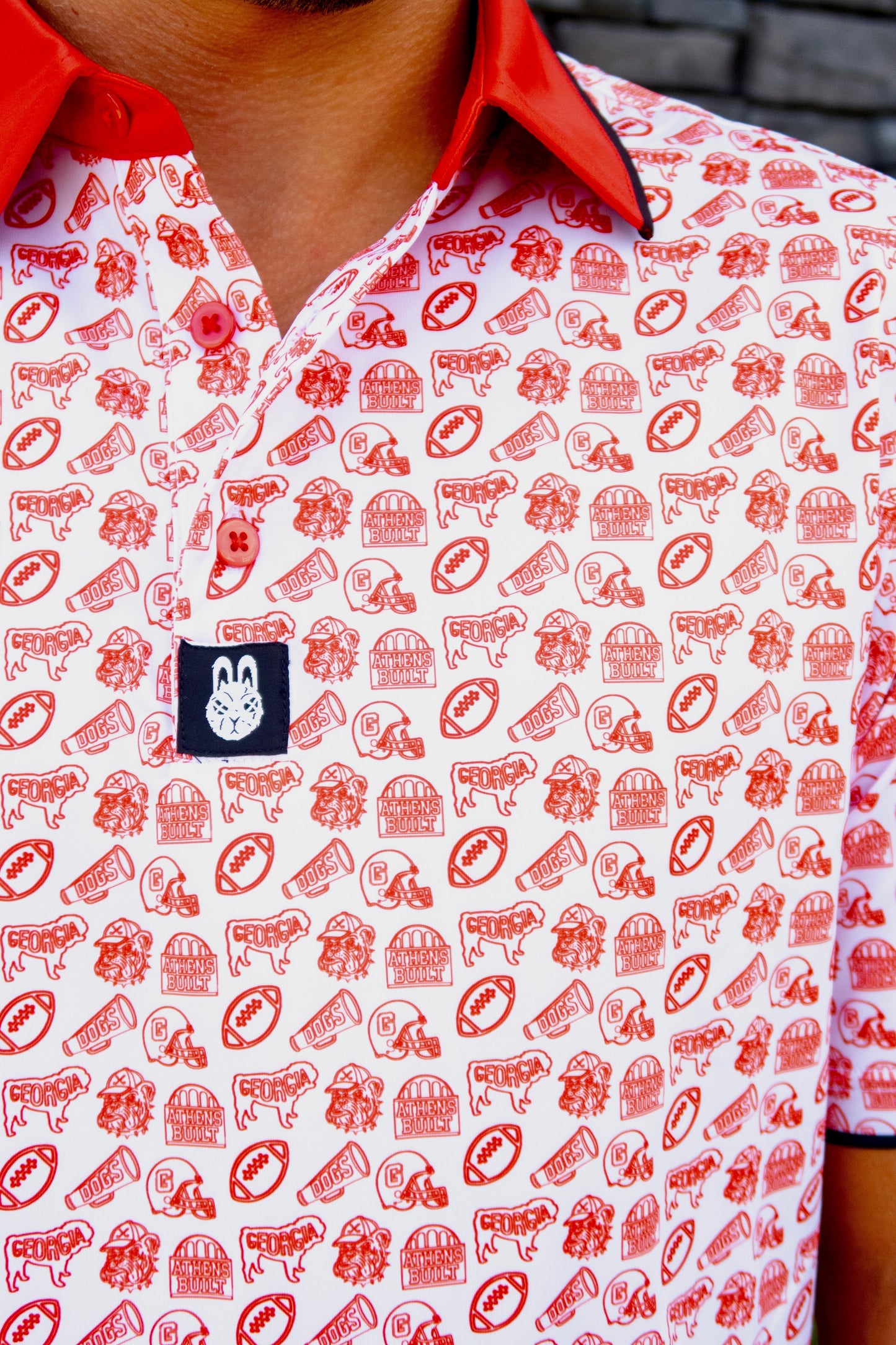 Close-up of the Saturdays in Athens Georgia inspired golf polo by Foresome Golf Co. showing fabric and logo.