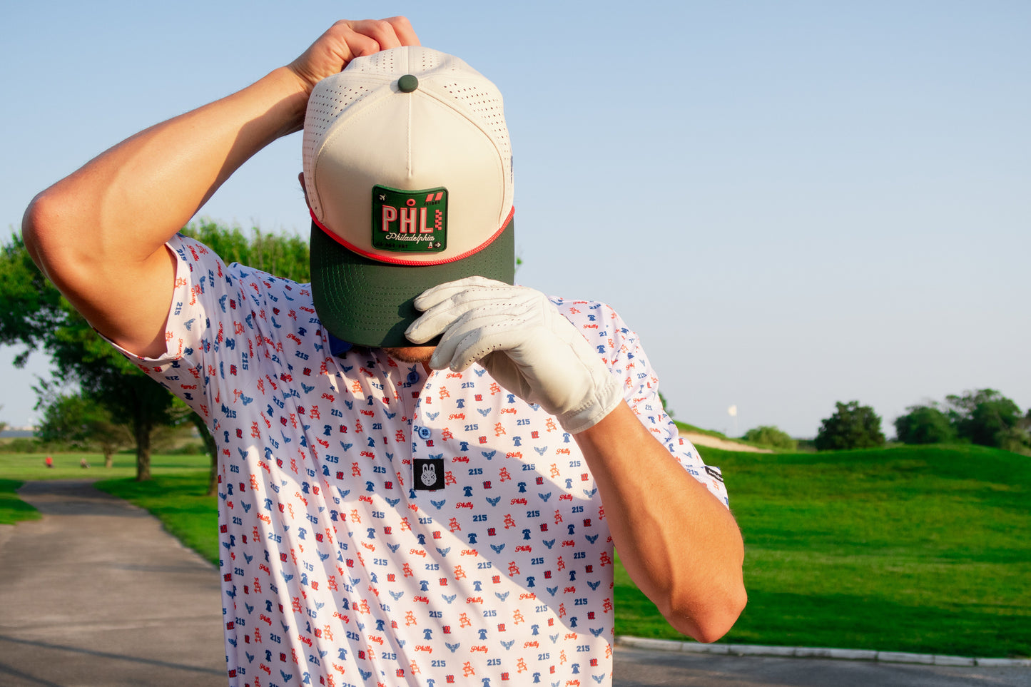 Alternate front angle of The Philly Phrenetic golf polo by Foresome Golf Co. showing collar and chest logo.