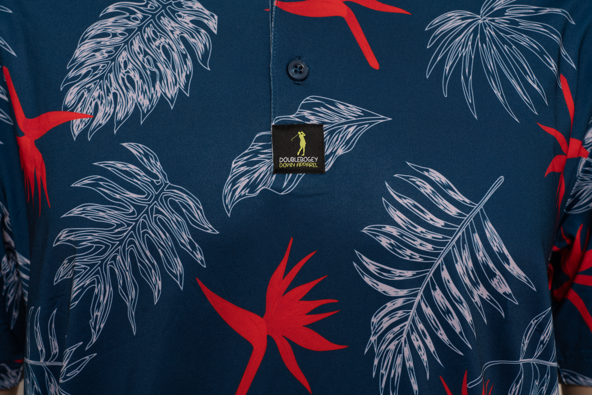 Close-up of tropical floral pattern on Bahama Mama golf polo – bold, colorful design that adds personality and island flair to your golf outfit.