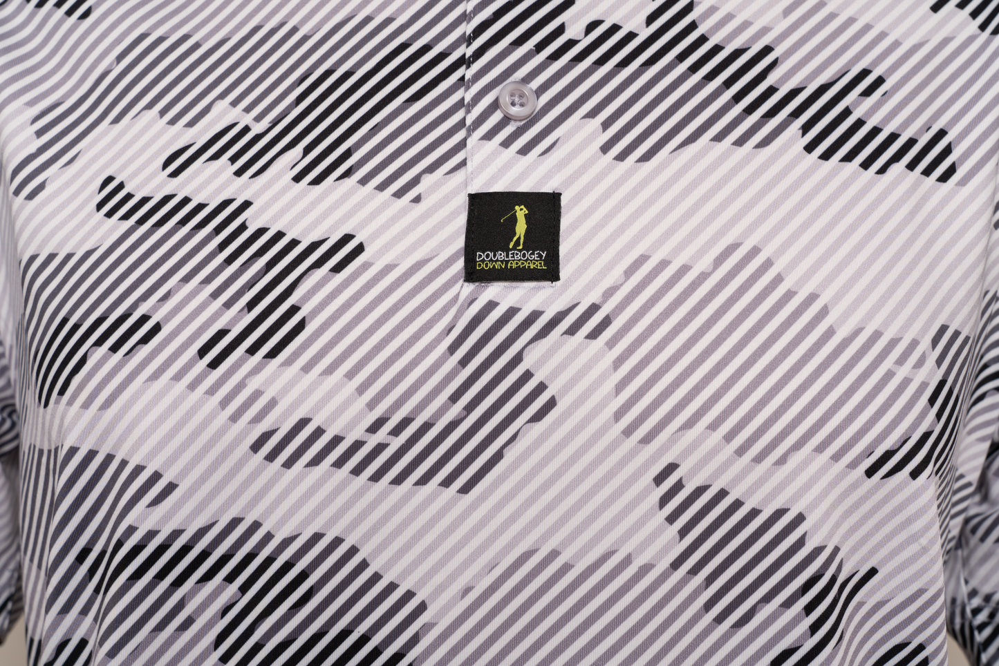 Close-up of Operation Birdie men’s camo polo design – unique camo pattern blending fashion and function for a standout look on the course.