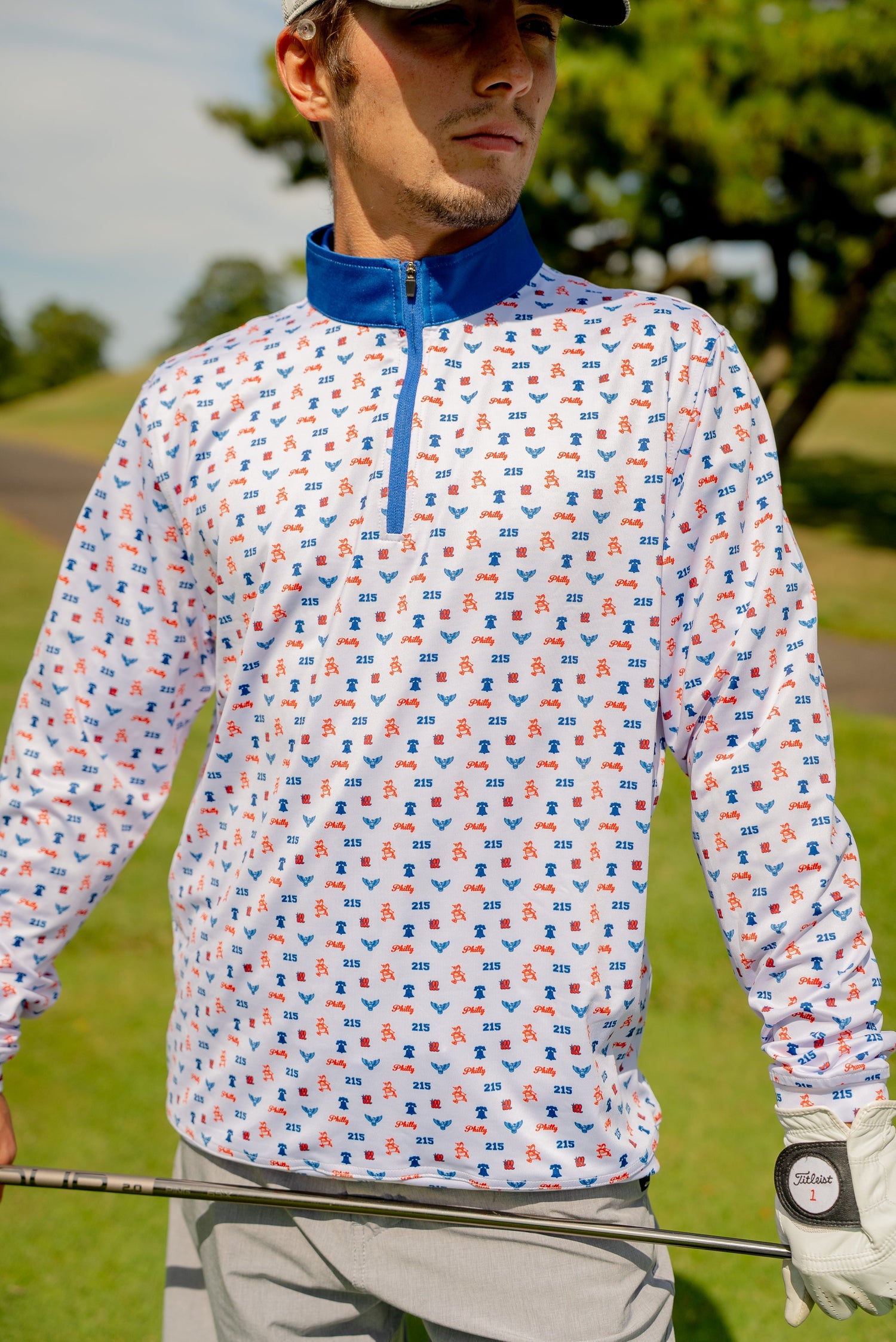 Front view of the Philly Phrenetic Quarter Zip men’s golf pullover by Foresome Golf Co. showing logo and modern fit