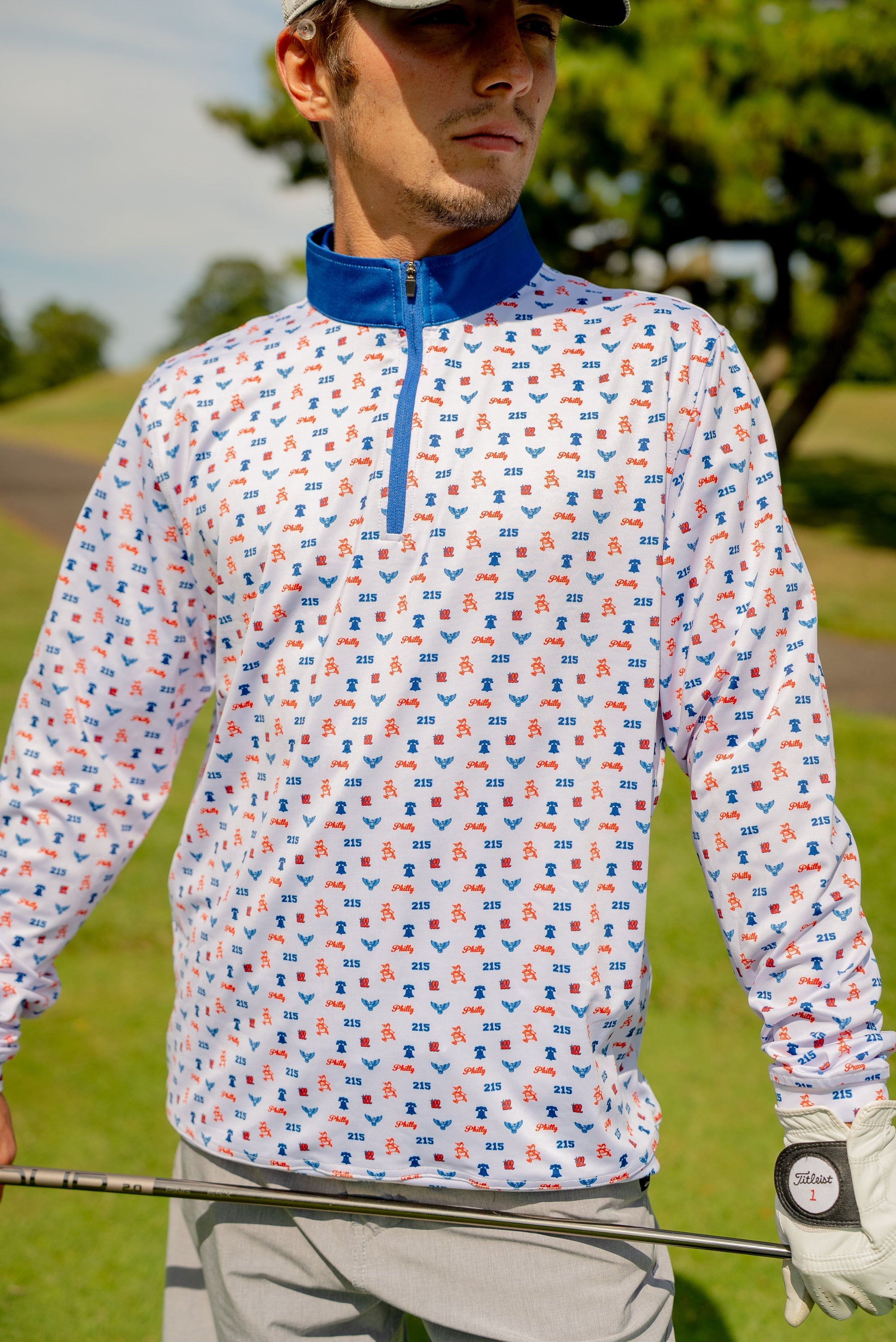 Front view of the Philly Phrenetic Quarter Zip men’s golf pullover by Foresome Golf Co. showing logo and modern fit