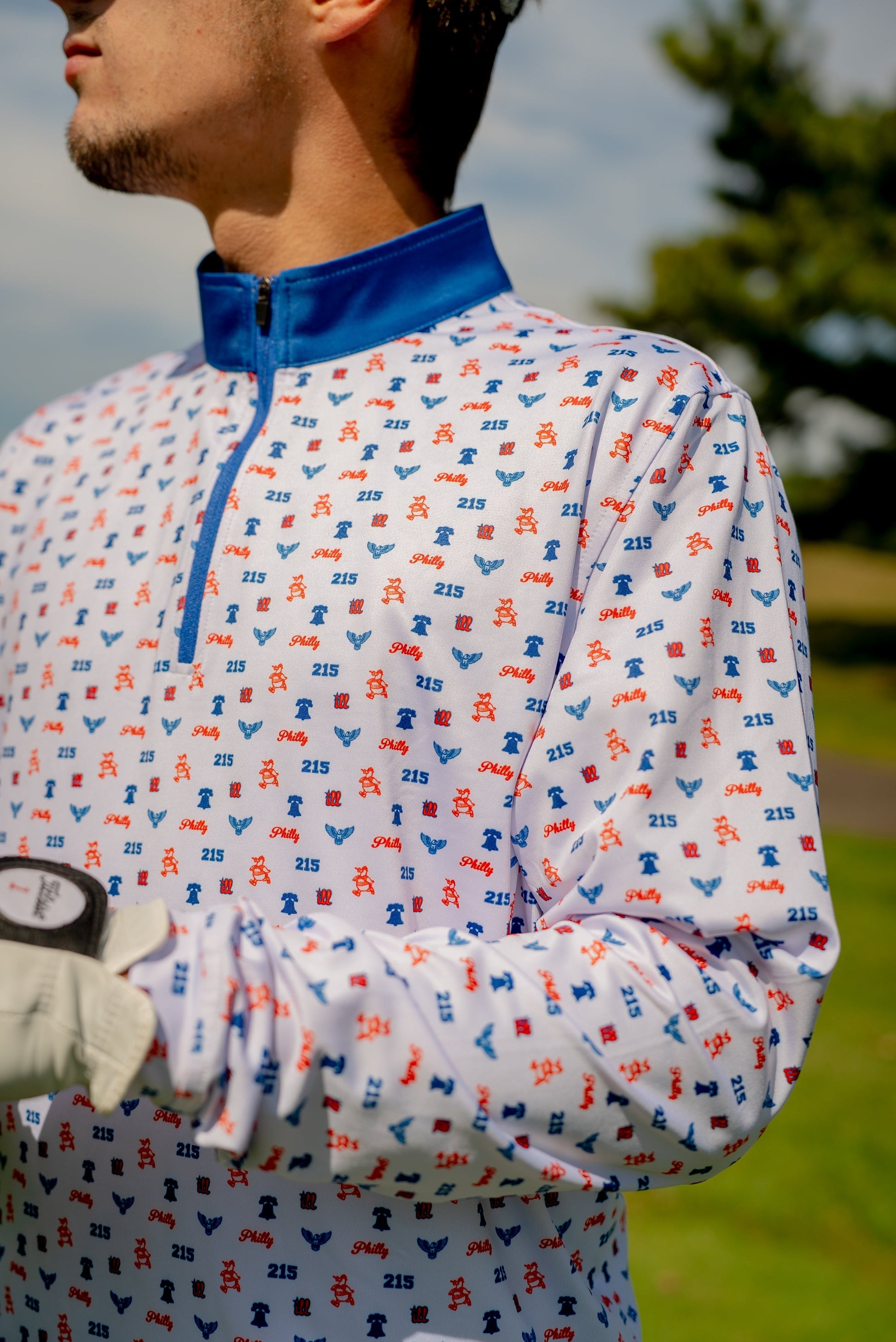 Close-up of the Philly Phrenetic Quarter Zip men’s golf pullover by Foresome Golf Co. highlighting fabric texture and chest logo