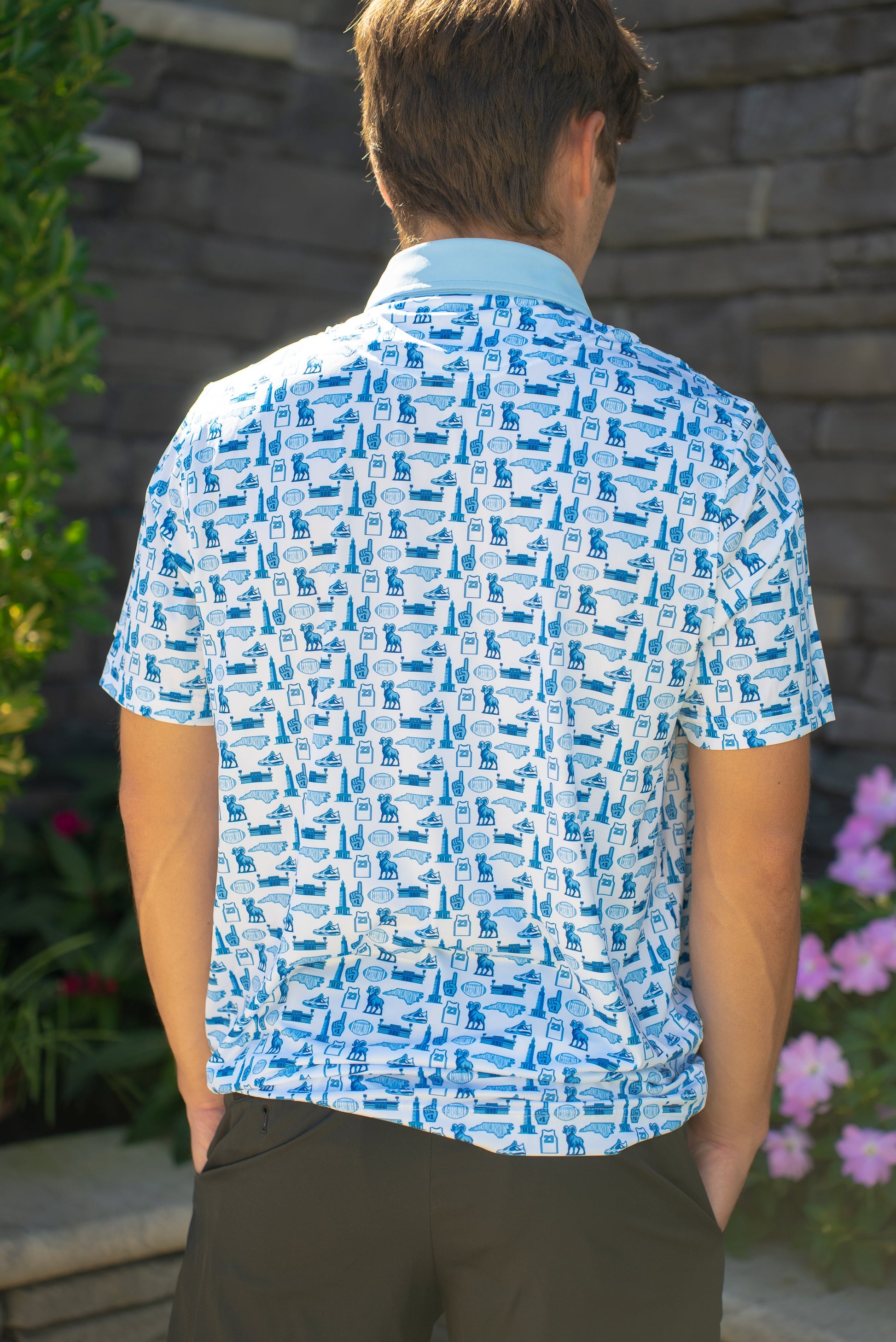 Back view of the Chapel Hill Hangtime UNC-inspired men’s golf polo by Foresome Golf Co. showing full design.