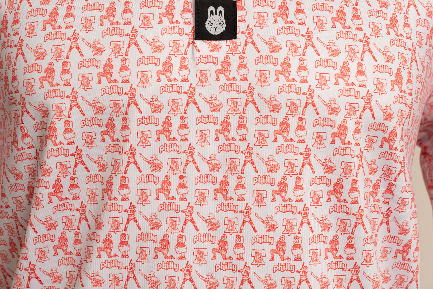 Close-up of The South Philly Sandlot Philly baseball golf polo by Foresome Golf Co. showing texture and logo.